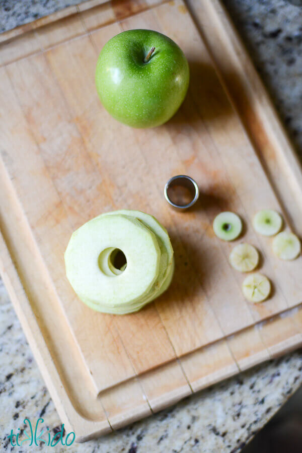 Apples cut into thin slices with the center core removed with a small, round cookie cutter.