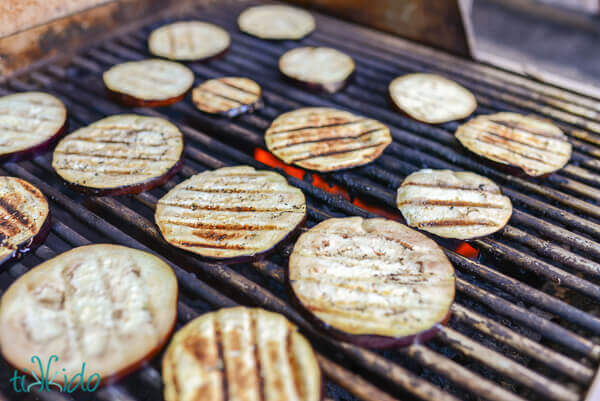 Eggplant slices on a grill.