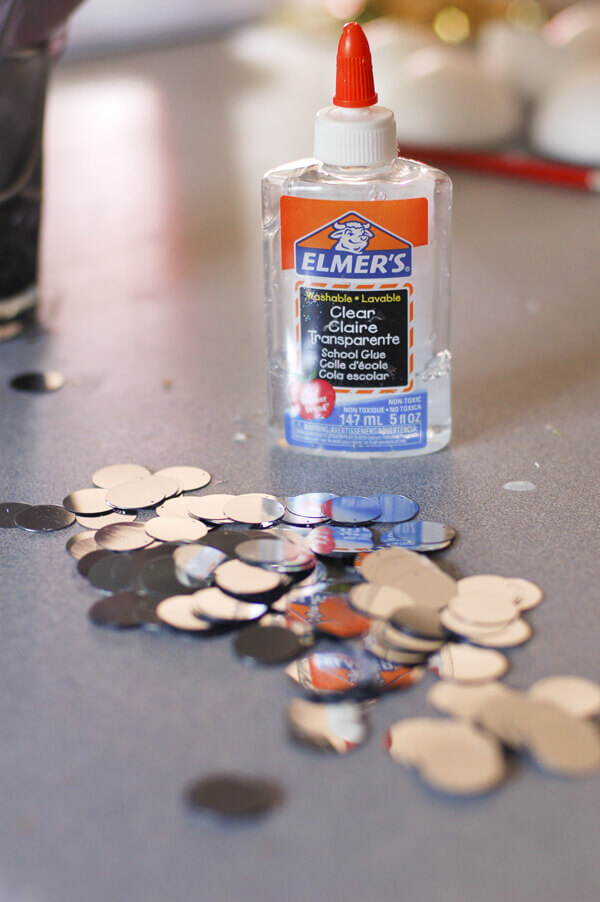 Clear Elmer's glue and silver paillettes. 