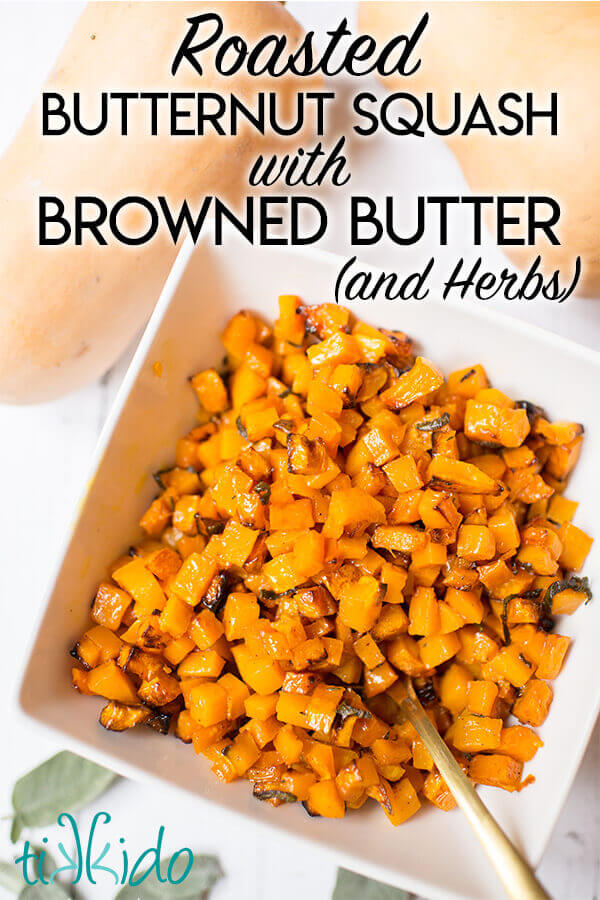 Roasted Butternut Squash Cubes tossed with browned butter and herbs in a white bowl.