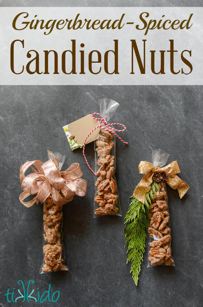 Three bags of Gingerbread Spiced Candied Pecans topped with gift tags and ribbons, with text overlay reading "Gingerbread Spiced Candied Nuts."