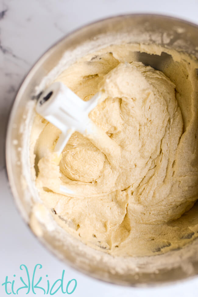 Vanilla Butter Cake batter in a Kitchenaid mixing bowl.