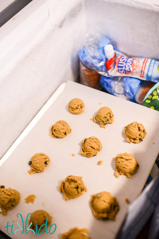 Browned Butter Chocolate Chip Cookie dough scooped on a parchment lined baking sheet, and in the freezer before baking.