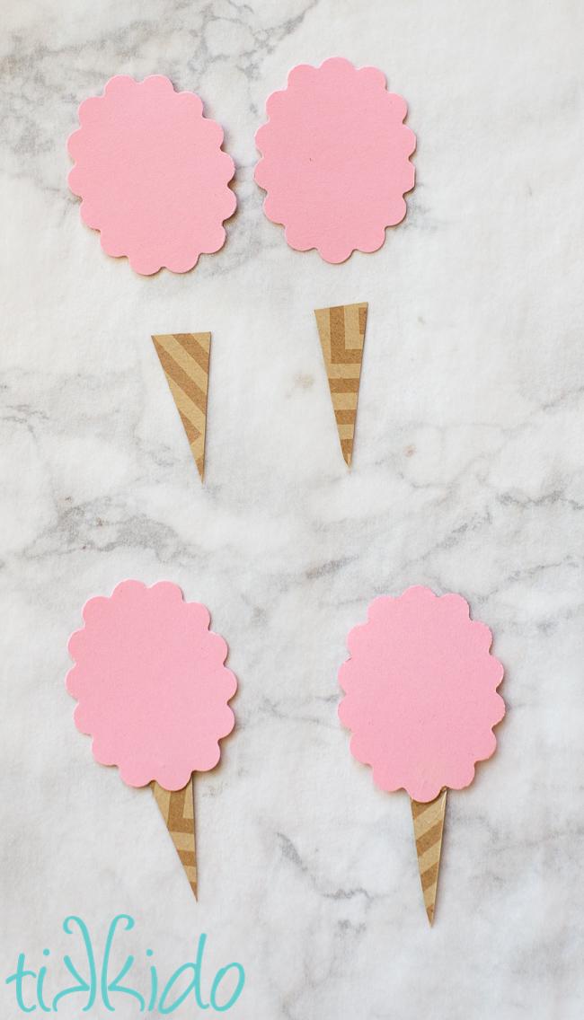 Scrapbook paper being used to make paper cotton candy embellishments.