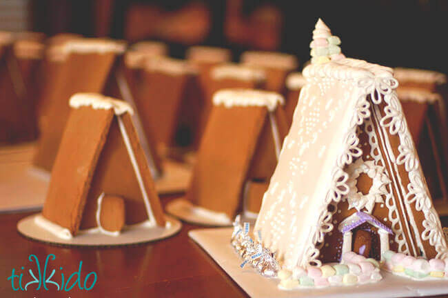 Gingerbread houses assembled and decorated with royal icing.