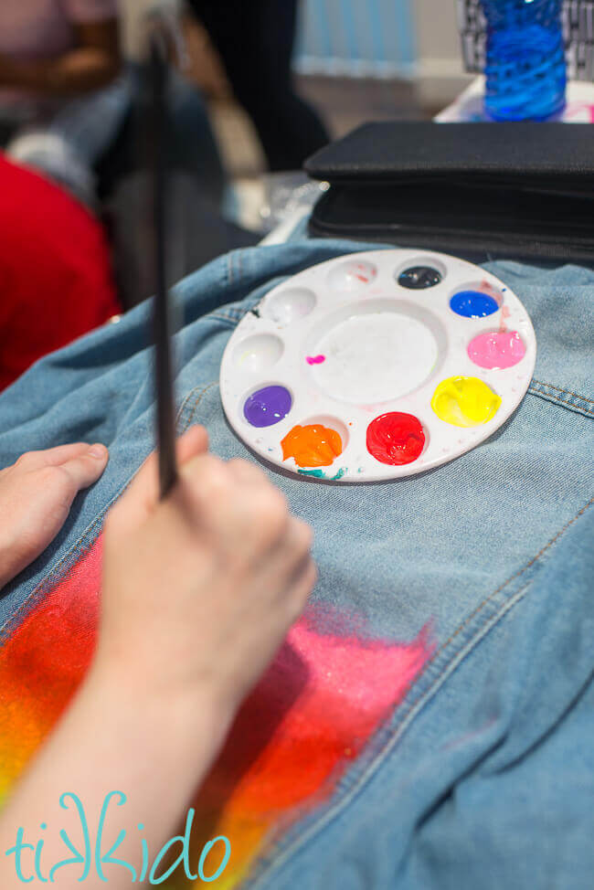 Denim jacket painting at a Culture Hustle workshop run by artist Jade Laurice.