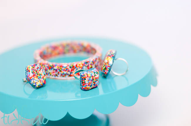 Resin jewelry filled with real sprinkles for favors for a sprinkles birthday party