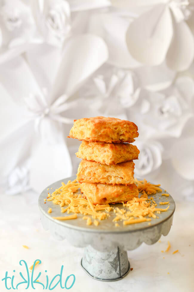 Sriracha Cheddar Biscuits  stacked on a galvanized metal cake stand.