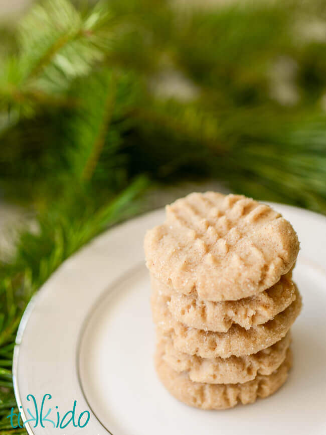 Stack of browned butter cookies on a white plate.