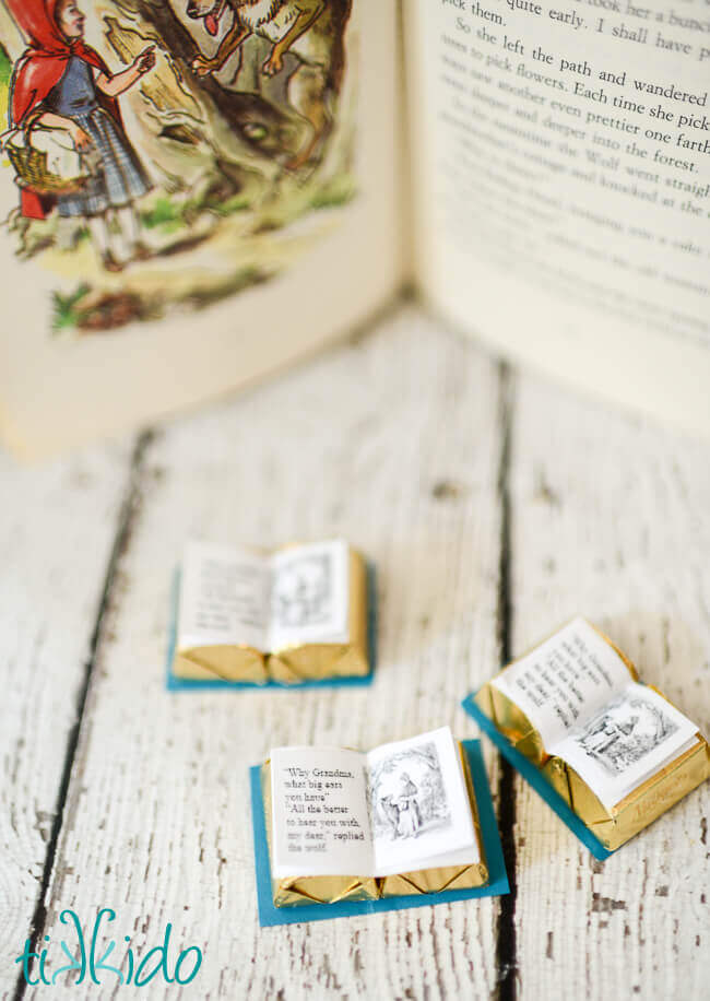 Chocolate book favors for a Little Red Riding Hood party in front of a fairy tale book.