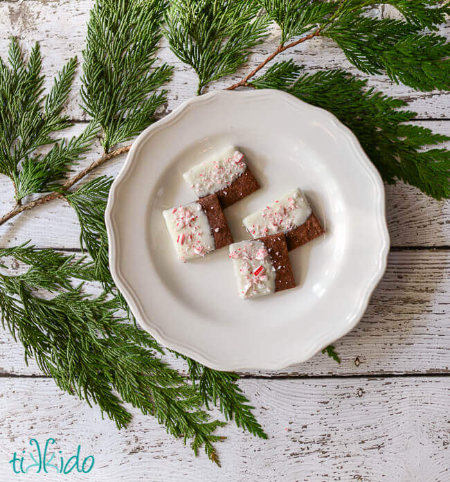Chocolate Shortbread Cookies dipped in white chocolate and sprinkled with crushed candy canes.