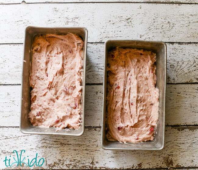 Cranberry Nut Bread batter in two loaf pans.