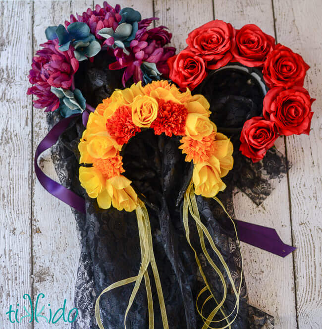 Three Day of the Dead headpieces made with silk flowers and black lace veils.