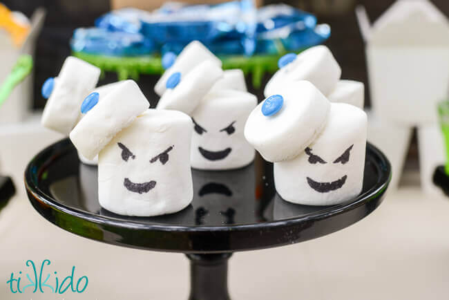 Ghostbusters Stay Puft Marshmallow Treats on a black cake stand.
