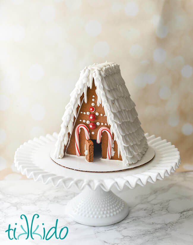 A frame Gingerbread house decorated with royal icing and candies.