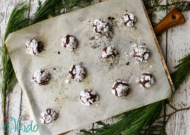 Baked Gluten Free chocolate crinkle cookies on a cookie sheet