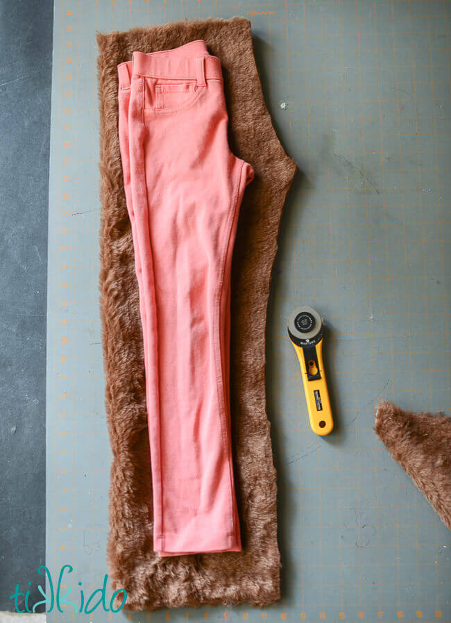 Faun Costume Pants being cut out of fake fur.