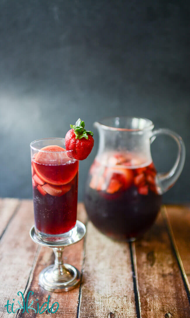 Glass and a pitcher of red sangria