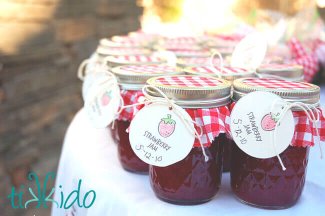 Homemade strawberry jam favors at the Strawberry Picnic birthday.