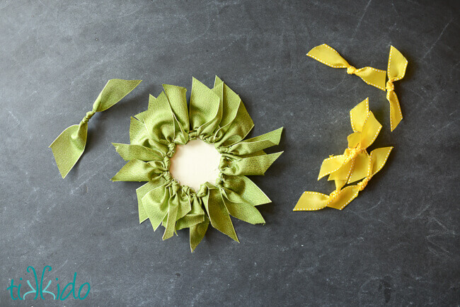 Leaves and petals of the ribbon sunflower being assembled.