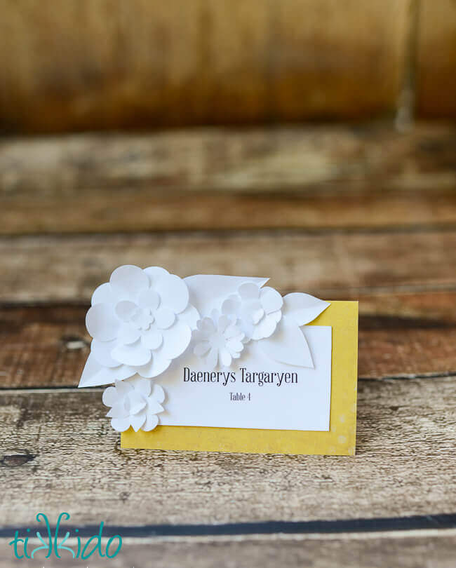 DIY wedding seating card decorated with paper flowers