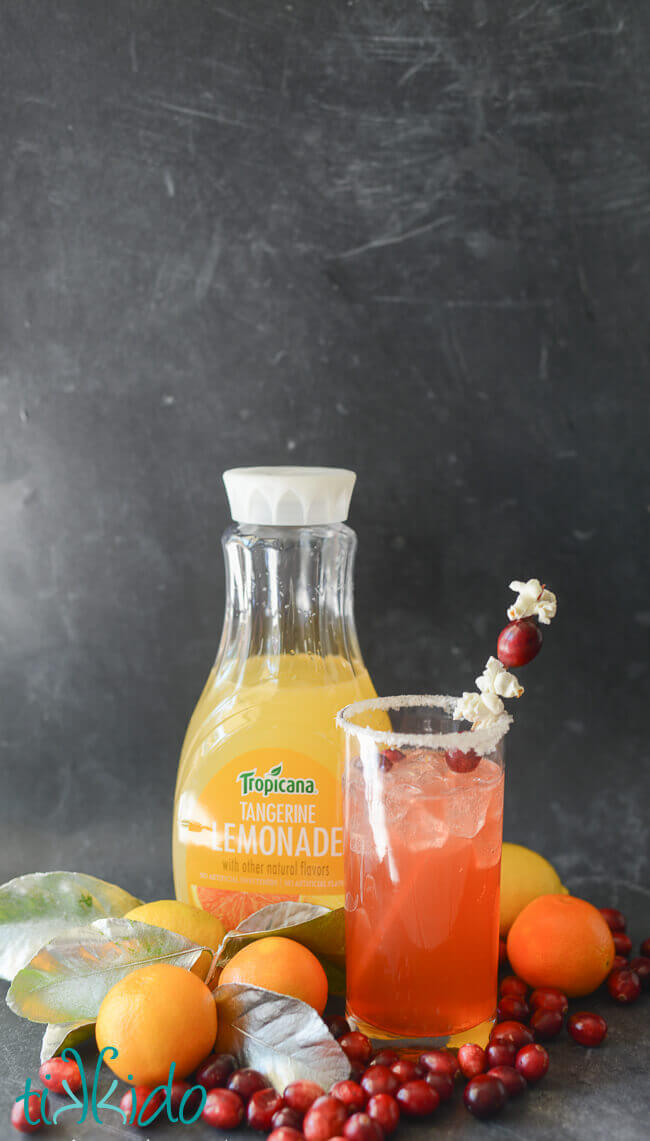 Merry and Bright Citrus Christmas Cocktail in front of a bottle of Tropicana tangerine lemonade.
