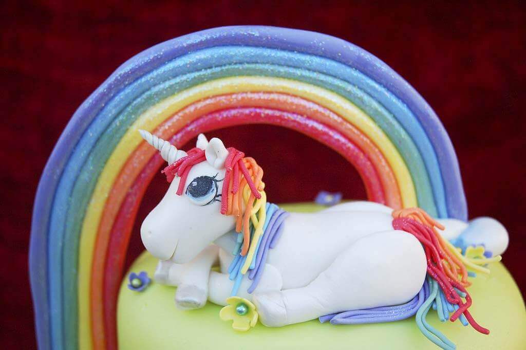 Rainbow Unicorn birthday cake unicorn and rainbow cake topper.