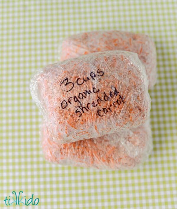 Two bundles of frozen shredded carrots labeled "3 cups organic shredded carrot"