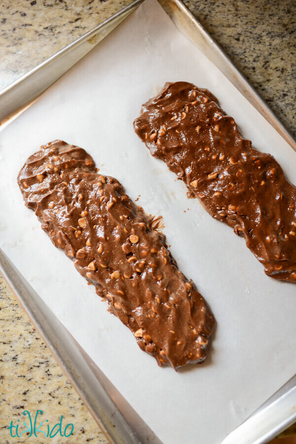 Peanut Butter and Chocolate Biscotti Cookie dough formed into logs on a parchment lined baking sheet