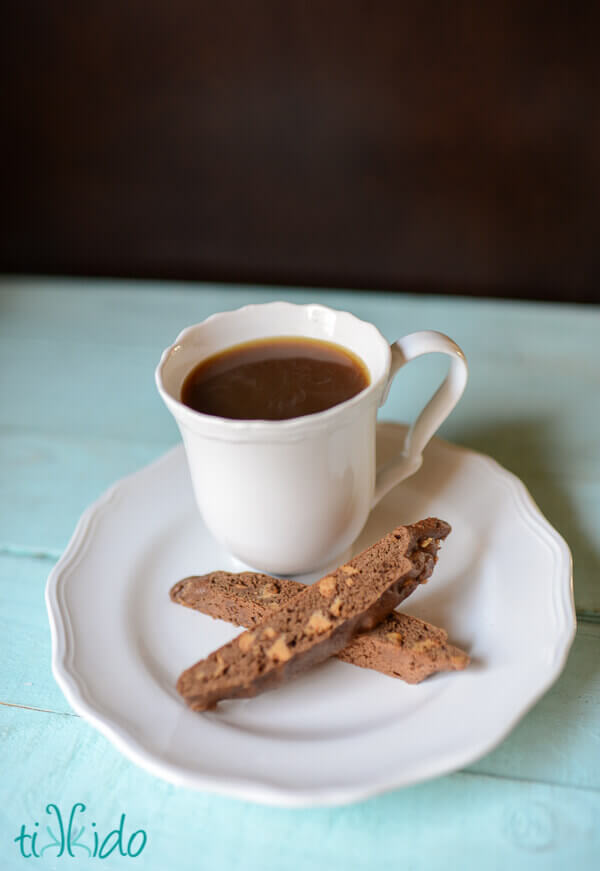Peanut Butter and Chocolate Biscotti Cookies next to a cup of coffee