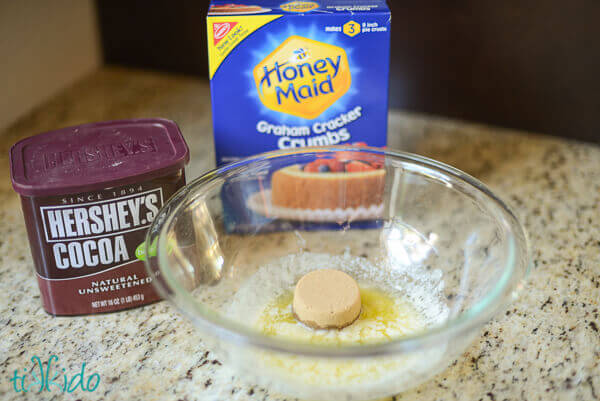 Ingredients for chocolate graham cracker pie crust made with regular graham crackers and cocoa powder.