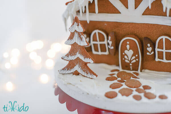 Gingerbread cobblestones in front of a gingerbread house.