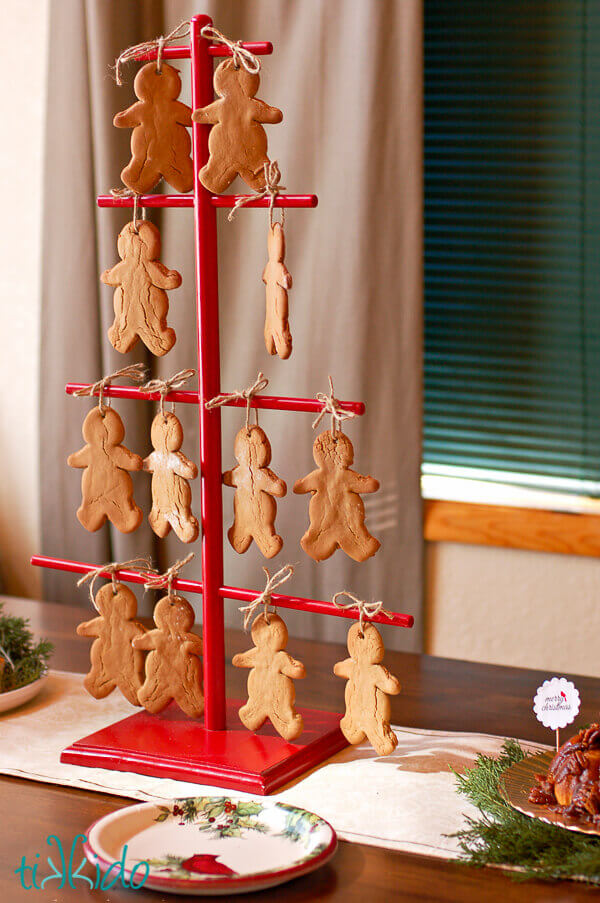 Gingerbread men Christmas ornaments made from real gingerbread hanging on a Swedish cookie tree.