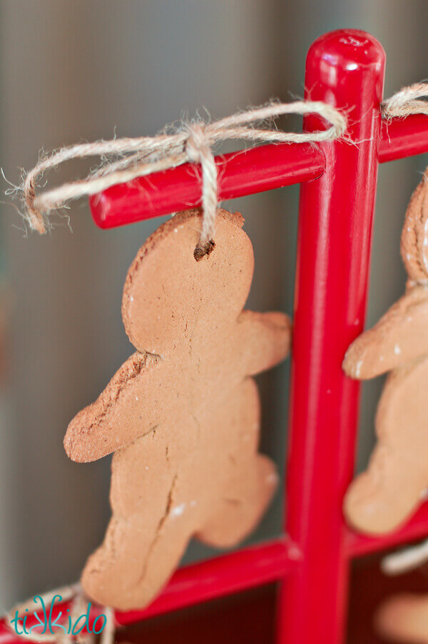 Gingerbread Christmas ornaments hanging from a Swedish cookie tree.