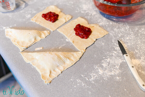 Puff pastry easy hand pies being assembled.