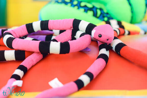 Stuffed snakes in the bounce house as a favor at the Jungle Party