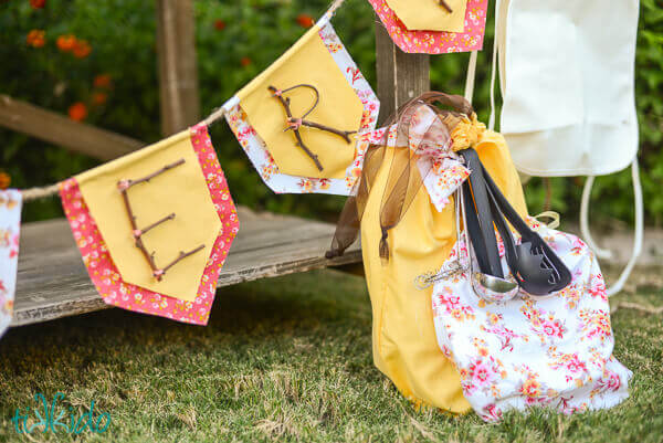 Play cooking equipment in fabric bags as party favors at the Mud Pie Bakery birthday party.