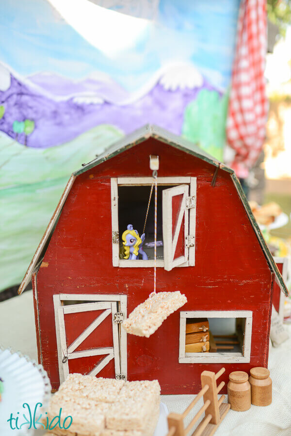 Antique toy barn used as a prop on the My Little Pony party dessert table.
