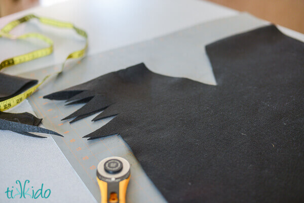 Jagged sleeve of the Peter Pan's escaped shadow tunic cut with a rotary cutter on a self healing mat.