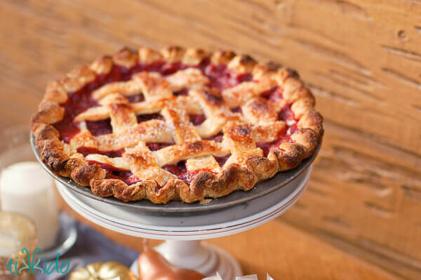 Cherry pie on a cake plate.