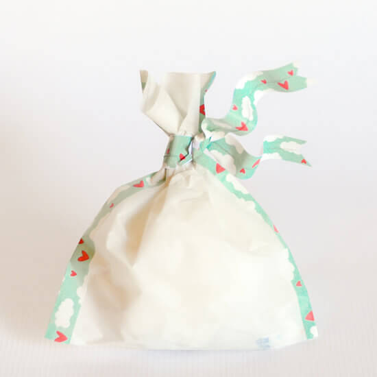 DIY favor bag made from parchment paper and washi tape.