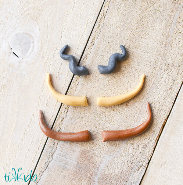 Gum paste horns for helmets on viking cupcakes.