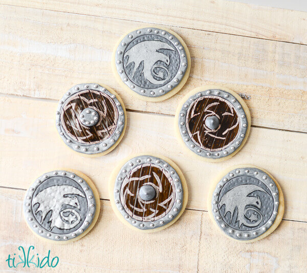 Viking Shield Cookies on a whitewashed wooden background.