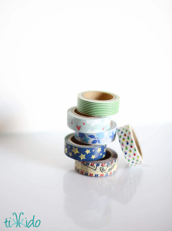 Stack of rolls of washi tape on a white background.