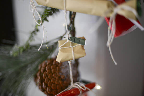 Advent calendar made from a garland of small, individually wrapped presents.