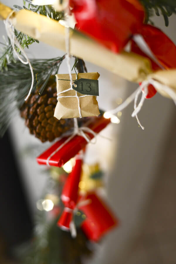 Advent calendar made from a garland of small, individually wrapped presents.