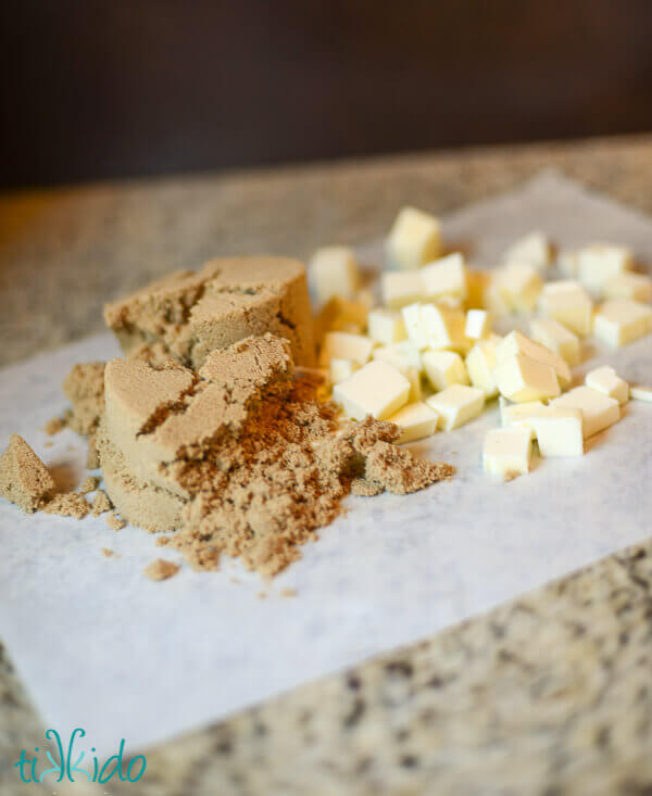 brown sugar and cubed butter on parchment paper