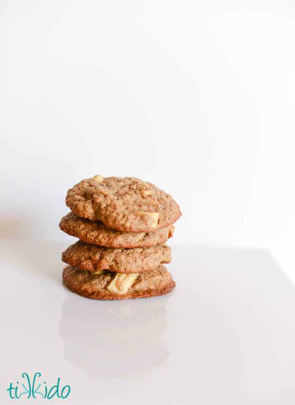 Stack of apple oatmeal cookies on a white background