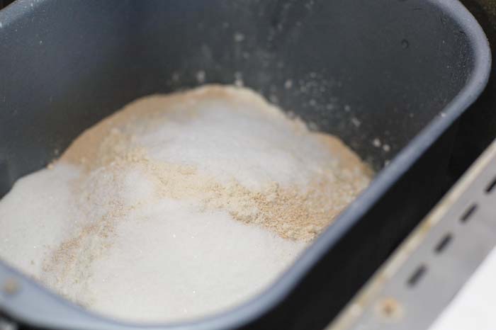 Ingredients for homemade bagels in a bread machine to make the dough.