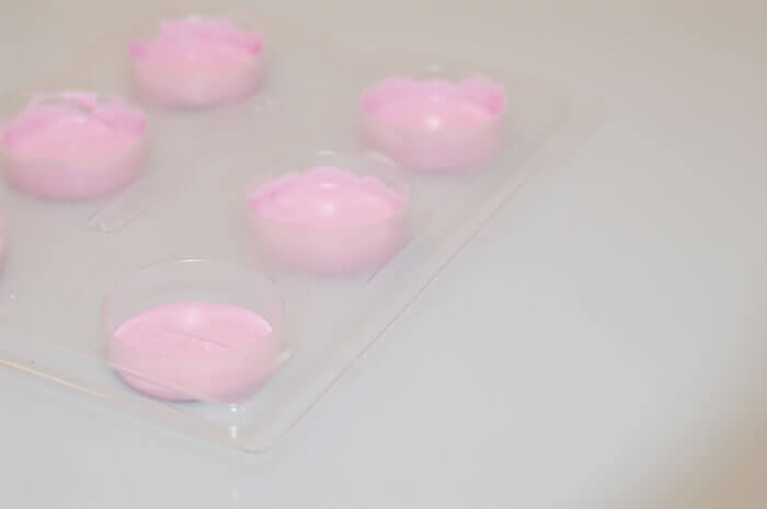 Pink chocolate for chocolate covered oreos in a chocolate covered oreo mold.